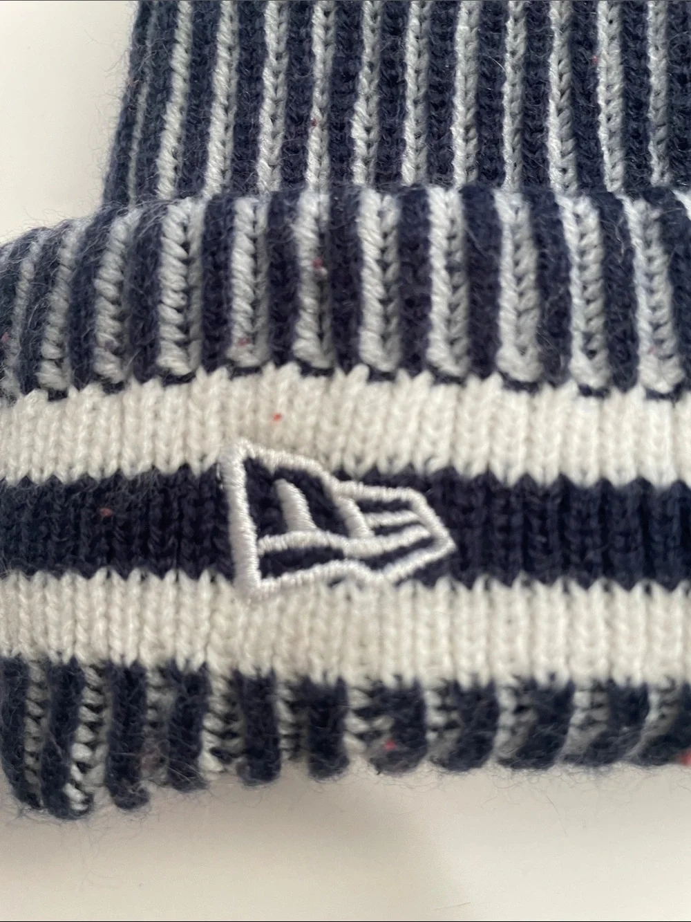New Era Navy and White Striped Pom Beanie for the Youth
